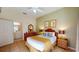 Cozy bedroom with a queen-size bed, dresser, and ensuite bathroom at 702 Rum Run # 38702, Davenport, FL 33897