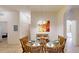 Glass dining table and chairs in a condo unit at 702 Rum Run # 38702, Davenport, FL 33897