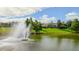 Water fountain with a community clubhouse in the background at 702 Rum Run # 38702, Davenport, FL 33897