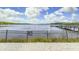 Scenic lake view with a wooden dock and metal fence at 702 Rum Run # 38702, Davenport, FL 33897