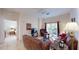 Comfortable living room with brown sofas and access to bedroom at 702 Rum Run # 38702, Davenport, FL 33897