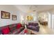 Spacious living room with brown sofas and view of dining area at 702 Rum Run # 38702, Davenport, FL 33897