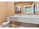 Bathroom with floating vanity and toilet at 7575 Brooklyn Dr, Kissimmee, FL 34747