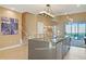 Modern kitchen island with stainless steel appliances and light-filled breakfast bar at 7575 Brooklyn Dr, Kissimmee, FL 34747