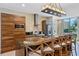 Modern kitchen with island seating and stainless steel appliances at 7575 Brooklyn Dr, Kissimmee, FL 34747