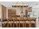 Island kitchen with wood cabinets and chandelier at 7575 Brooklyn Dr, Kissimmee, FL 34747