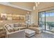 L-shaped sectional sofa and access to backyard patio at 7575 Brooklyn Dr, Kissimmee, FL 34747