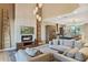 Spacious living area with fireplace and kitchen view at 7575 Brooklyn Dr, Kissimmee, FL 34747