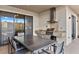 Outdoor kitchen with grill, granite countertop, and dining area at 7575 Brooklyn Dr, Kissimmee, FL 34747