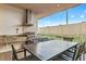 Outdoor kitchen with grill and dining area at 7575 Brooklyn Dr, Kissimmee, FL 34747