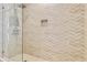 Walk-in shower with herringbone patterned tile at 7575 Brooklyn Dr, Kissimmee, FL 34747