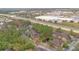 Aerial view of apartment community nestled in a wooded area near a highway and shopping center at 814 Crest Pines Dr # 937, Orlando, FL 32828