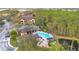 Aerial view of apartment community, pool, and surrounding trees at 814 Crest Pines Dr # 937, Orlando, FL 32828