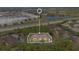 Aerial view of apartment building with surrounding trees and parking at 814 Crest Pines Dr # 937, Orlando, FL 32828