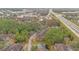 Aerial view of community near highway and pond at 814 Crest Pines Dr # 937, Orlando, FL 32828
