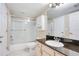 Clean bathroom with granite vanity and tub shower at 814 Crest Pines Dr # 937, Orlando, FL 32828