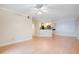 Bright living room with hardwood floors and kitchen bar at 814 Crest Pines Dr # 937, Orlando, FL 32828