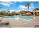 Inviting community pool area with lounge chairs and a clubhouse at 814 Crest Pines Dr # 937, Orlando, FL 32828