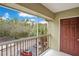 Screened balcony overlooks the parking lot and surrounding trees at 814 Crest Pines Dr # 937, Orlando, FL 32828