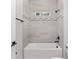 Bathroom with grey tile and bathtub at 8549 Sw 129Th Ln, Ocala, FL 34473