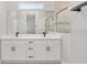 Double vanity bathroom with white cabinets, quartz countertops, and a large shower at 8549 Sw 129Th Ln, Ocala, FL 34473