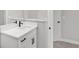 Modern bathroom with white vanity and black fixtures at 8549 Sw 129Th Ln, Ocala, FL 34473