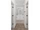 Bright bathroom hallway with double vanity and carpet flooring at 8549 Sw 129Th Ln, Ocala, FL 34473