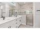 Double vanity bathroom with quartz countertop and large shower at 8549 Sw 129Th Ln, Ocala, FL 34473