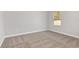 Bright bedroom with carpeted floor and large window at 8549 Sw 129Th Ln, Ocala, FL 34473
