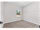 Bright bedroom with carpet and window at 8549 Sw 129Th Ln, Ocala, FL 34473