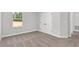 Well-lit bedroom with carpet and double doors at 8549 Sw 129Th Ln, Ocala, FL 34473