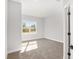 Bright bedroom with carpeted floor and large window at 8549 Sw 129Th Ln, Ocala, FL 34473
