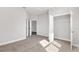 Bright bedroom with carpeted floor and walk-in closet at 8549 Sw 129Th Ln, Ocala, FL 34473