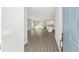 View through entryway to open concept living space with hardwood floors at 8549 Sw 129Th Ln, Ocala, FL 34473