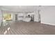Open concept kitchen with white cabinets and stainless steel appliances at 8549 Sw 129Th Ln, Ocala, FL 34473