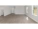 Spacious living area with hardwood floors and multiple windows at 8549 Sw 129Th Ln, Ocala, FL 34473