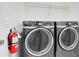 Laundry room with washer, dryer, and fire extinguisher at 9011 Azalea Sands Ln # 9011, Davenport, FL 33896