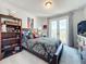 Charming bedroom with themed decor and access to a private balcony at 9317 Holliston Creek Pl, Winter Garden, FL 34787