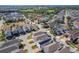 Aerial view of a vibrant community showcasing modern homes, lush landscaping, and community amenities at 9317 Holliston Creek Pl, Winter Garden, FL 34787