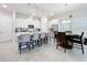 Bright and airy kitchen with white cabinetry, quartz countertops, and stainless steel appliances at 9317 Holliston Creek Pl, Winter Garden, FL 34787