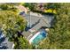 Aerial view of house, showcasing roofline and pool at 1000 Via Tuscany Oaks Way, Winter Park, FL 32789