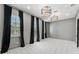 Bright bedroom with gray walls, black curtains, and a checkered floor at 1000 Via Tuscany Oaks Way, Winter Park, FL 32789