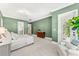 Main bedroom with green walls, ample space, and access to private bathroom at 1000 Via Tuscany Oaks Way, Winter Park, FL 32789