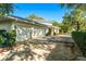 Three-car garage with a basketball court nearby at 1000 Via Tuscany Oaks Way, Winter Park, FL 32789