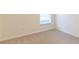 Empty bedroom with neutral carpeting and window at 1028 Cinnamon Fern Ct, Casselberry, FL 32707