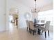 Bright dining area with wood table and view to the kitchen at 1028 Cinnamon Fern Ct, Casselberry, FL 32707