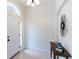 Bright and airy entryway with tile floors and a console table at 1028 Cinnamon Fern Ct, Casselberry, FL 32707