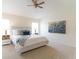 Spacious primary bedroom with a ceiling fan and large art piece at 1028 Cinnamon Fern Ct, Casselberry, FL 32707