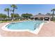 Community pool with lounge chairs and cabana at 1028 Cinnamon Fern Ct, Casselberry, FL 32707