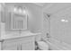 Updated bathroom with white vanity and marble tile at 1058 Florida Holly Dr, Orlando, FL 32811